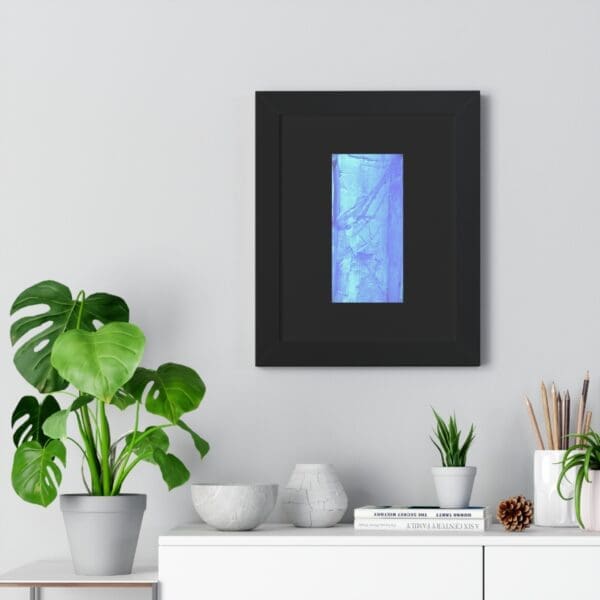 Framed blue artwork above white shelf decor.