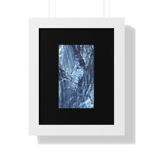 Framed abstract blue and black painting.