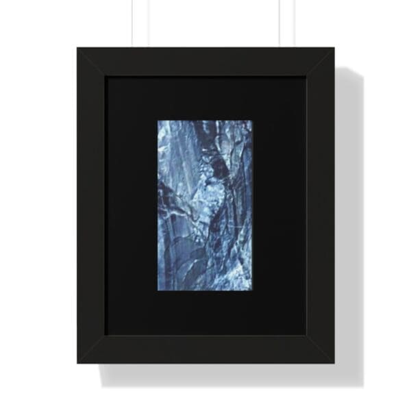 Framed abstract blue and gray artwork.