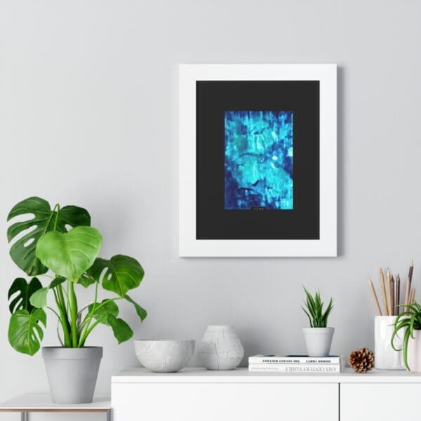 Framed abstract art above minimalist shelf decor.